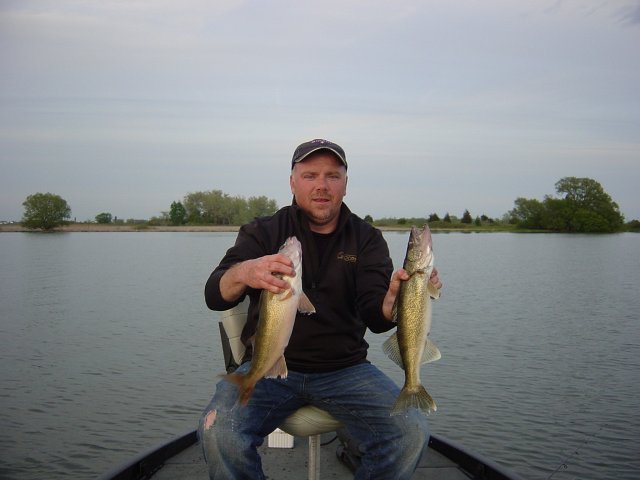 walleye hay bay quinte 008.jpg - Kevin with two nice Walleye from Hay Bay – Quinte